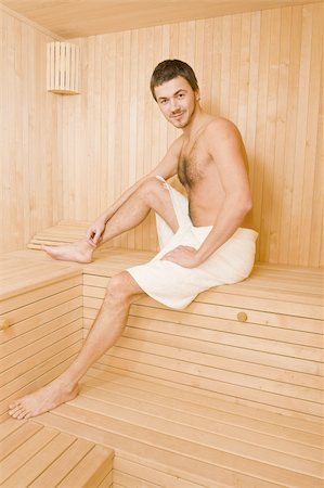 Young handsome man in a towel relaxing in a russian wooden sauna Stock Photo - Budget Royalty-Free & Subscription, Code: 400-05281732