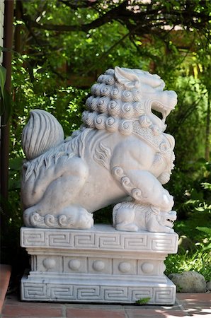 simsearch:400-06426873,k - Lion statue scultured in stone at a resort in Hue, Vietnam Stock Photo - Budget Royalty-Free & Subscription, Code: 400-05282182