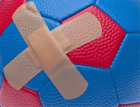 simsearch:400-04263545,k - Youth Sports Injury Concept Soccer Ball with Bandage. Stock Photo - Budget Royalty-Free & Subscription, Code: 400-05282212