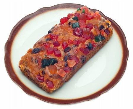 Holiday Fruit Cake on a Dish Isolated on White with a Clipping Path. Stock Photo - Budget Royalty-Free & Subscription, Code: 400-05282551