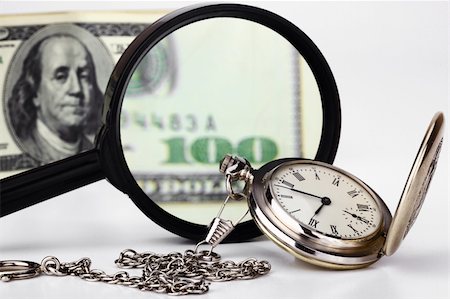 Watches and money on a white background Fotografie stock - Microstock e Abbonamento, Codice: 400-05282898