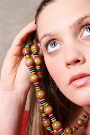simsearch:400-04266572,k - Beautiful female model with blue eyes and a string beads Stock Photo - Budget Royalty-Free & Subscription, Code: 400-05283088