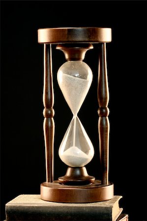 Hourglass close up over black Stock Photo - Budget Royalty-Free & Subscription, Code: 400-05283212