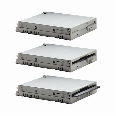 Floppy drive in three actions: empty, full and inserting. Body parts(viewpoint, focal length, size and etc) are identical Photographie de stock - Aubaine LD & Abonnement, Code: 400-05283252