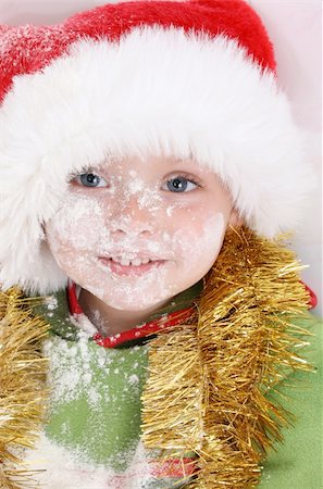 Toddler wearing a christmas hat, baking christmas cookies Stock Photo - Budget Royalty-Free & Subscription, Code: 400-05283365