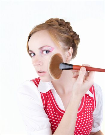 Young beautiful girl with cosmetics brushes Stock Photo - Budget Royalty-Free & Subscription, Code: 400-05283641