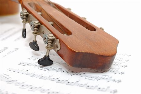 simsearch:400-07301387,k - Fingerboard of old guitar under leaf with notes Foto de stock - Super Valor sin royalties y Suscripción, Código: 400-05294126