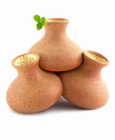 Three vases from the ceramics with the leaf of clover Foto de stock - Super Valor sin royalties y Suscripción, Código: 400-05294257