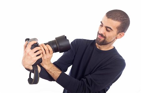 shooting the head with the hand - Young Man Photographer Taking Photos Stock Photo - Budget Royalty-Free & Subscription, Code: 400-05294514