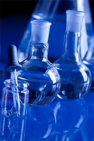 fikmik (artist) - Laboratory Glassware in blue table in laboratory Foto de stock - Royalty-Free Super Valor e Assinatura, Número: 400-05294866