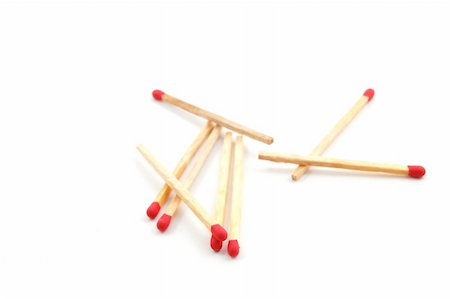 simsearch:600-00866511,k - Some red matches isolated on a white background. Photographie de stock - Aubaine LD & Abonnement, Code: 400-05295025