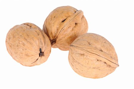 simsearch:400-04290468,k - ripe walnuts isolated on white background Foto de stock - Super Valor sin royalties y Suscripción, Código: 400-05295330