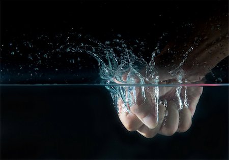 the hand dropped into water Stock Photo - Budget Royalty-Free & Subscription, Code: 400-05295474