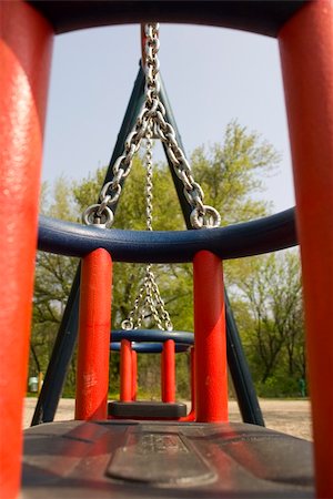 empty playground - Modern chain swing from interesting perspectival view Stock Photo - Budget Royalty-Free & Subscription, Code: 400-05295589