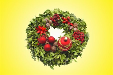 simsearch:400-07614285,k - Christmas decoration wreath over yellow background Stock Photo - Budget Royalty-Free & Subscription, Code: 400-05295620