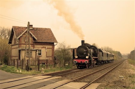 simsearch:862-03288971,k - Vintage steam train passing through countryside Stock Photo - Budget Royalty-Free & Subscription, Code: 400-05296088