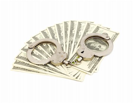 Handcuffs on money background, business security concept Stock Photo - Budget Royalty-Free & Subscription, Code: 400-05296504