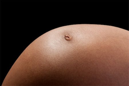 simsearch:400-06849973,k - Pregnant woman with her belly  over dark background Stock Photo - Budget Royalty-Free & Subscription, Code: 400-05296751