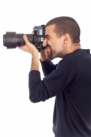 shooting the head with the hand - Young Man Photographer Taking Photos Stock Photo - Budget Royalty-Free & Subscription, Code: 400-05297168