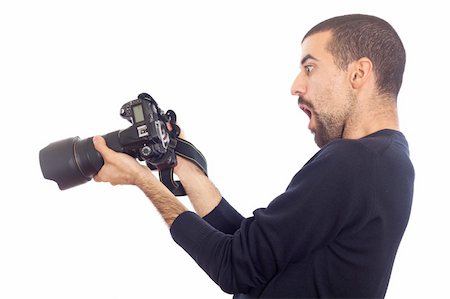 shooting the head with the hand - Young Man Photographer Looking Camera's Display Stock Photo - Budget Royalty-Free & Subscription, Code: 400-05297169