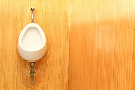 White urinal on the brown   wood textures background Stock Photo - Budget Royalty-Free & Subscription, Code: 400-05297420