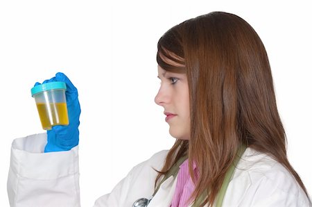 A beautiful young woman doctor holding a urine sample Stock Photo - Budget Royalty-Free & Subscription, Code: 400-05297689