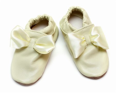 simsearch:400-04939110,k - Pair baby leather slippers on white background Photographie de stock - Aubaine LD & Abonnement, Code: 400-05298106