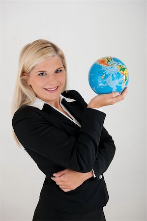 simsearch:400-04043891,k - Beautiful business woman in a suit with globe figure Photographie de stock - Aubaine LD & Abonnement, Code: 400-05298345