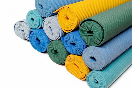 many colorfull yoga mats as a background. isolated on white background Stock Photo - Budget Royalty-Free & Subscription, Code: 400-05298349