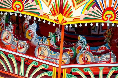 colorful motorcycle themed fairground ride Foto de stock - Super Valor sin royalties y Suscripción, Código: 400-05298380