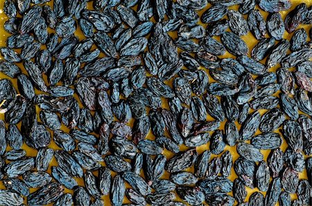 simsearch:400-07310170,k - Background made of dark dried raisins Fotografie stock - Microstock e Abbonamento, Codice: 400-05298405
