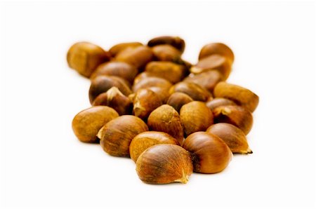 Many chestnuts isolated on the white background Fotografie stock - Microstock e Abbonamento, Codice: 400-05298412