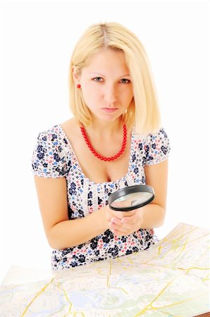 Attractive young blonde studying map over white background Stock Photo - Budget Royalty-Free & Subscription, Code: 400-05298484