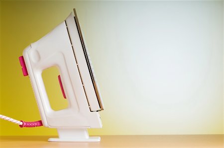 Modern electric iron against the colorful background Stock Photo - Budget Royalty-Free & Subscription, Code: 400-05298812