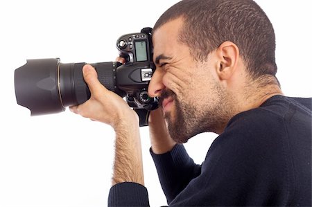 shooting the head with the hand - Young Man Photographer Taking Photos Stock Photo - Budget Royalty-Free & Subscription, Code: 400-05299036