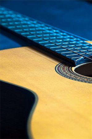 franky242 (artist) - Detail shot of a beautiful  acoustic guitar on dark velvet Fotografie stock - Microstock e Abbonamento, Codice: 400-05299148
