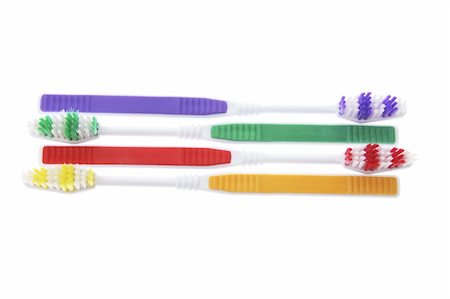 Arrangement of Toothbrushes on Isolated White Background Stock Photo - Budget Royalty-Free & Subscription, Code: 400-05290133