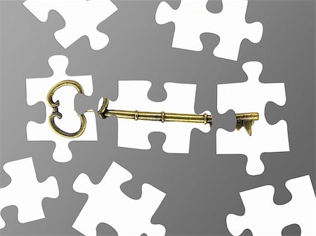 Jigsaw puzzle pieces of a key isolated against a grey background Stock Photo - Budget Royalty-Free & Subscription, Code: 400-05290595