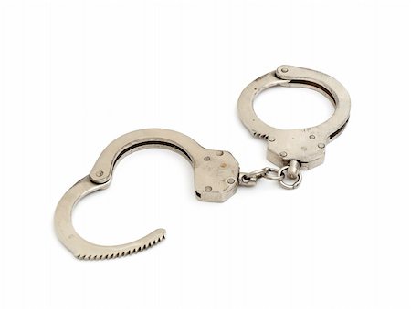 detective suspect - handcuffs are opened in the form of heart isolated on white Stock Photo - Budget Royalty-Free & Subscription, Code: 400-05290700