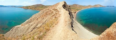 Summer rocky coastline and camping on sandy beach (Tihaja Bay (Koktebel Town in left), Crimea, Ukraine ). All peoples and cars is aunrecognizable, Three shots stitch image. Foto de stock - Royalty-Free Super Valor e Assinatura, Número: 400-05291396