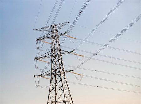 pylon in city - Electricity pylon against soft blue sky Stock Photo - Budget Royalty-Free & Subscription, Code: 400-05291608