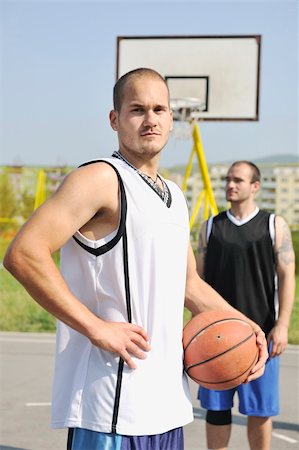basketball player team group  posing on streetbal court at the city on early morning Stock Photo - Budget Royalty-Free & Subscription, Code: 400-05291627