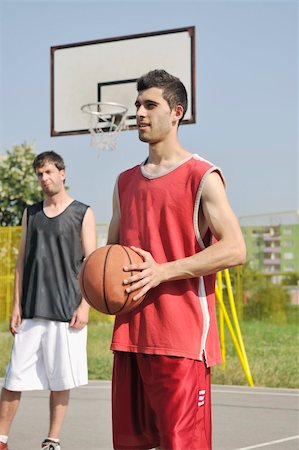 basketball player team group  posing on streetbal court at the city on early morning Stock Photo - Budget Royalty-Free & Subscription, Code: 400-05291629