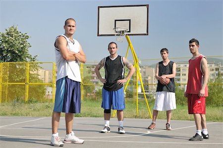 simsearch:400-03994929,k - basketball player team group  posing on streetbal court at the city on early morning Stockbilder - Microstock & Abonnement, Bildnummer: 400-05291623