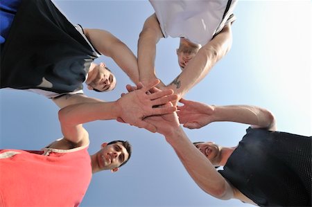 basketball player team group  posing on streetbal court at the city on early morning Stock Photo - Budget Royalty-Free & Subscription, Code: 400-05291631