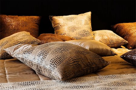 leather pillows on the bed in a modern bedroom Fotografie stock - Microstock e Abbonamento, Codice: 400-05291646