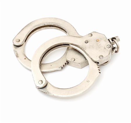 simsearch:400-05300234,k - steel metallic handcuffs (manacles) isolated on white background Fotografie stock - Microstock e Abbonamento, Codice: 400-05292016