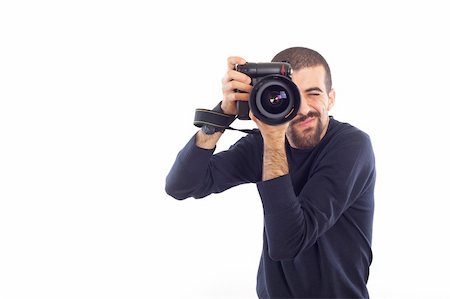 shooting the head with the hand - Young Man Photographer Taking Photos Stock Photo - Budget Royalty-Free & Subscription, Code: 400-05292094