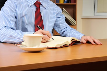 simsearch:400-04782141,k - Businessman at office working at his workplace. Stock Photo - Budget Royalty-Free & Subscription, Code: 400-05293054