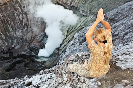 pretty blonde woman smoking - Woman meditatingat the crater of volcano Bromo. Java. Indonesia Stock Photo - Budget Royalty-Free & Subscription, Code: 400-05293151